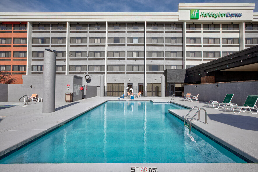 a swimming pool outside of a hotel