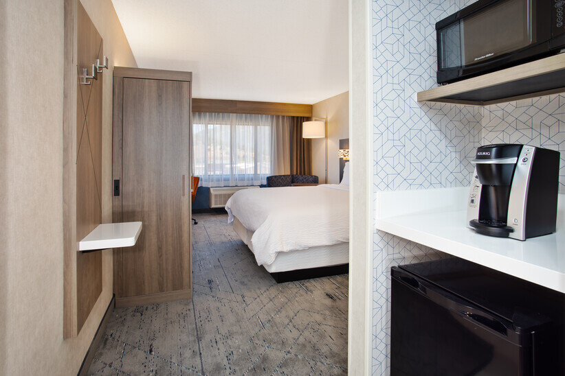 a room with a bed and microwave